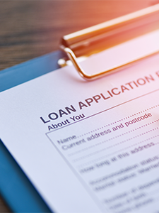 Business Loan application on a clipboard